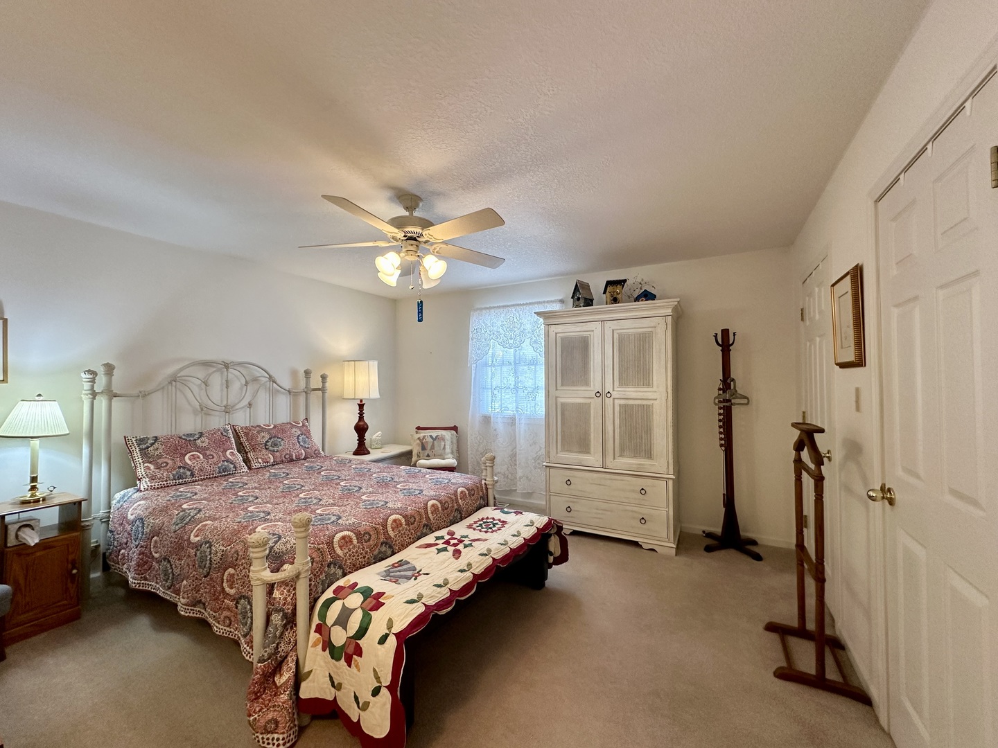 8752 Wagon Trail Road Clinton, IL 61727 - Photo 8 of 19 a bedroom with a bed and a chandelier