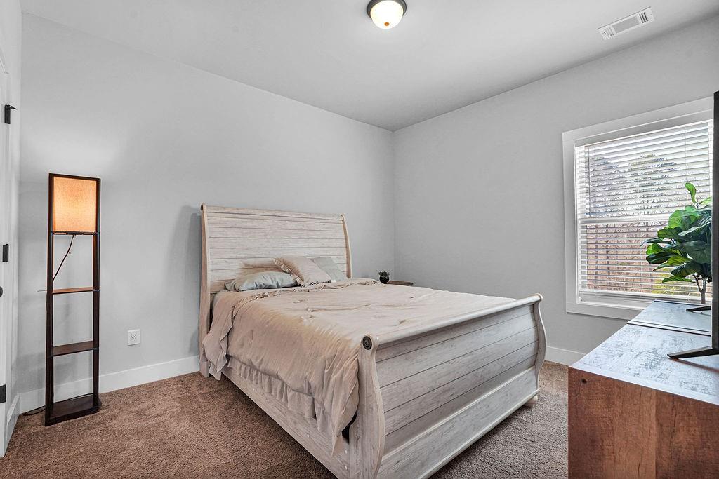 1201 Shiva Boulevard Winder, GA 30680 - Photo 15 of 84 a bedroom with a bed and window