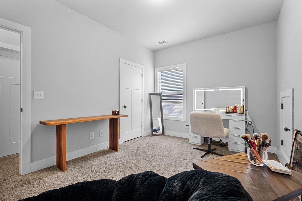 1201 Shiva Boulevard Winder, GA 30680 - Photo 16 of 84 a bedroom with furniture and a lamp