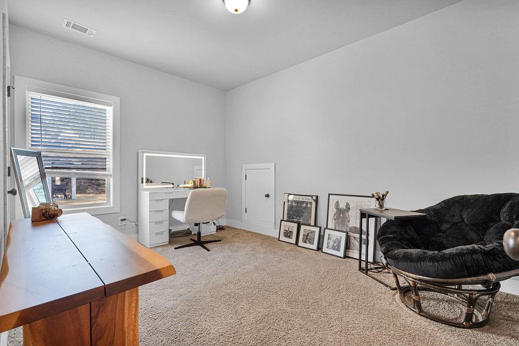 1201 Shiva Boulevard Winder, GA 30680 - Photo 18 of 84 a living room with furniture and a lamp