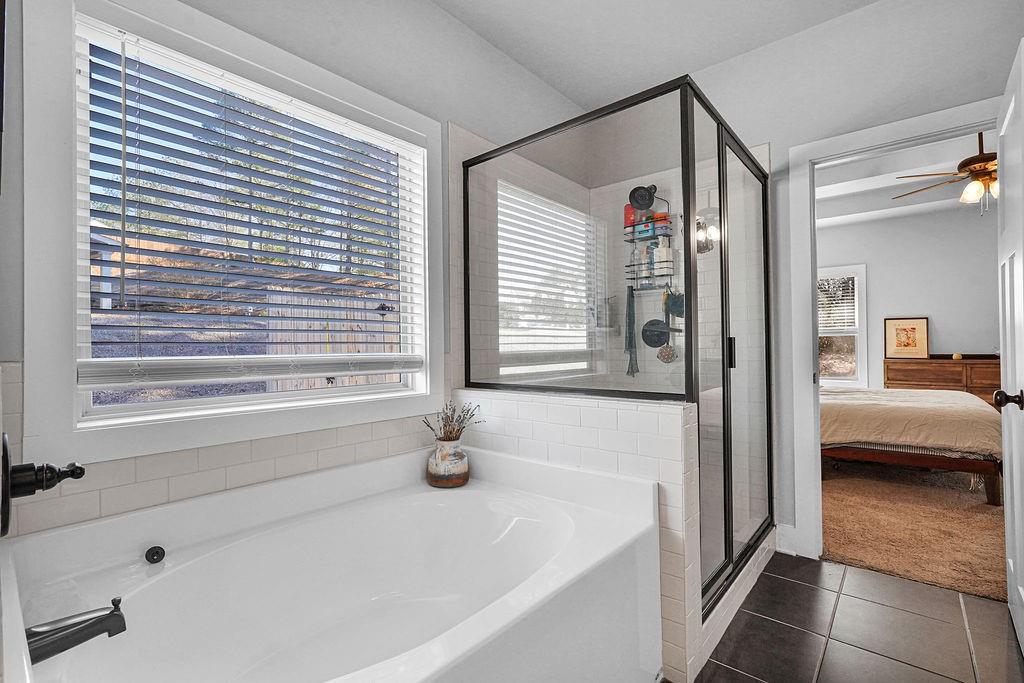 1201 Shiva Boulevard Winder, GA 30680 - Photo 21 of 84 a bathroom with a tub a sink and a window