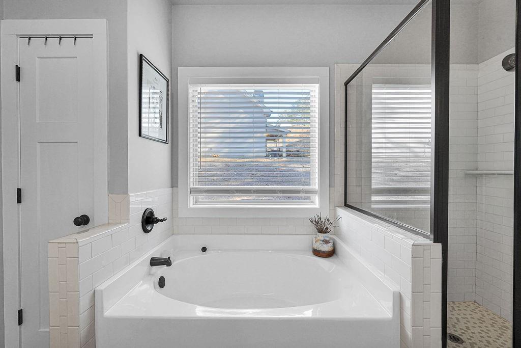 1201 Shiva Boulevard Winder, GA 30680 - Photo 23 of 84 a white bath tub sitting next to a window