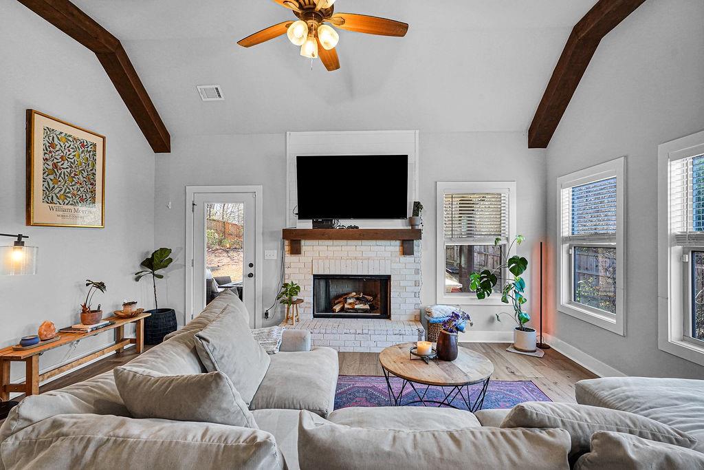 1201 Shiva Boulevard Winder, GA 30680 - Photo 30 of 84 a living room with furniture a fireplace and a flat screen tv