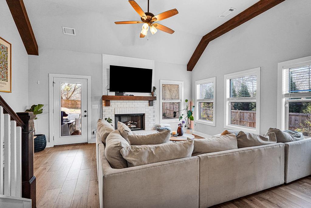 1201 Shiva Boulevard Winder, GA 30680 - Photo 38 of 84 a living room with furniture a fireplace and a flat screen tv