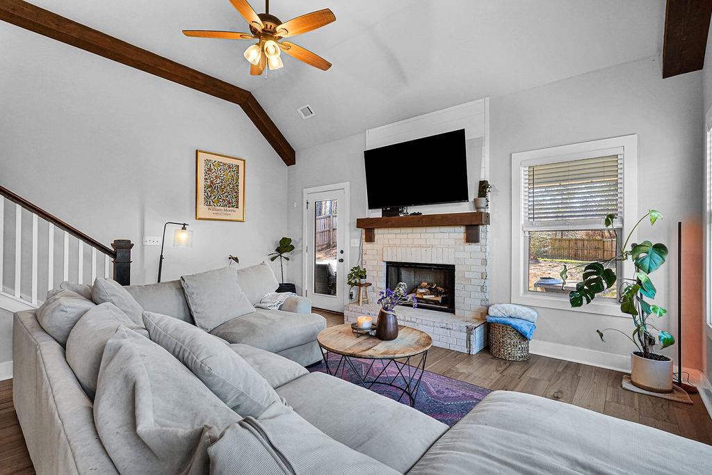 1201 Shiva Boulevard Winder, GA 30680 - Photo 48 of 84 a living room with furniture a fireplace and a flat screen tv