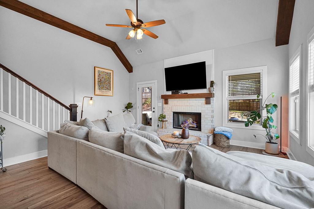 1201 Shiva Boulevard Winder, GA 30680 - Photo 49 of 84 a living room with furniture a fireplace and a flat screen tv