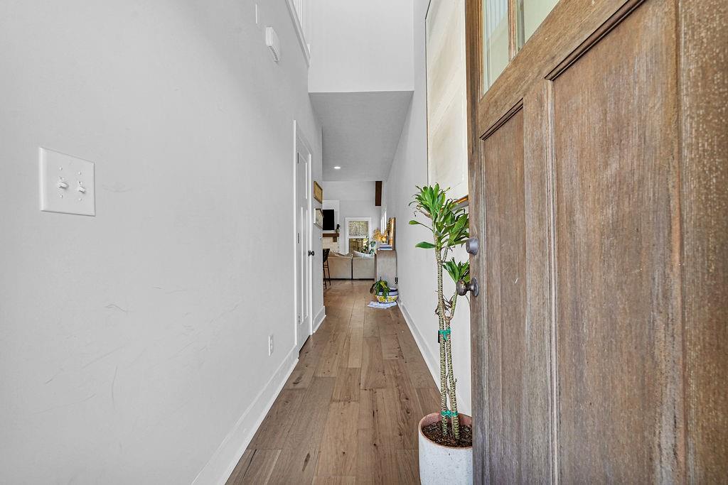 1201 Shiva Boulevard Winder, GA 30680 - Photo 57 of 84 a view of a hallway with wooden floor and staircase