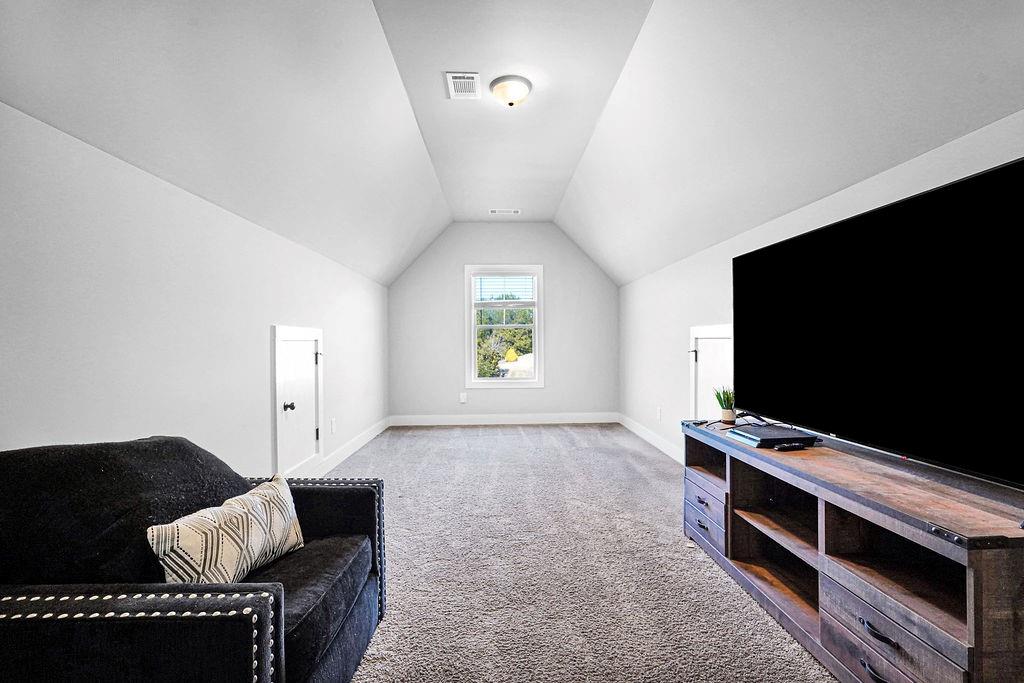 1201 Shiva Boulevard Winder, GA 30680 - Photo 8 of 84 a living room with furniture and a flat screen tv