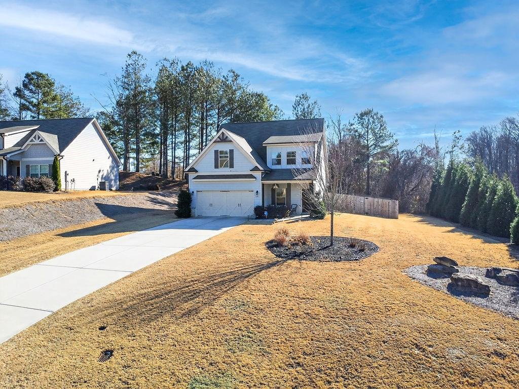 1201 Shiva Boulevard Winder, GA 30680 - Photo 81 of 84 a front view of a house with a yard