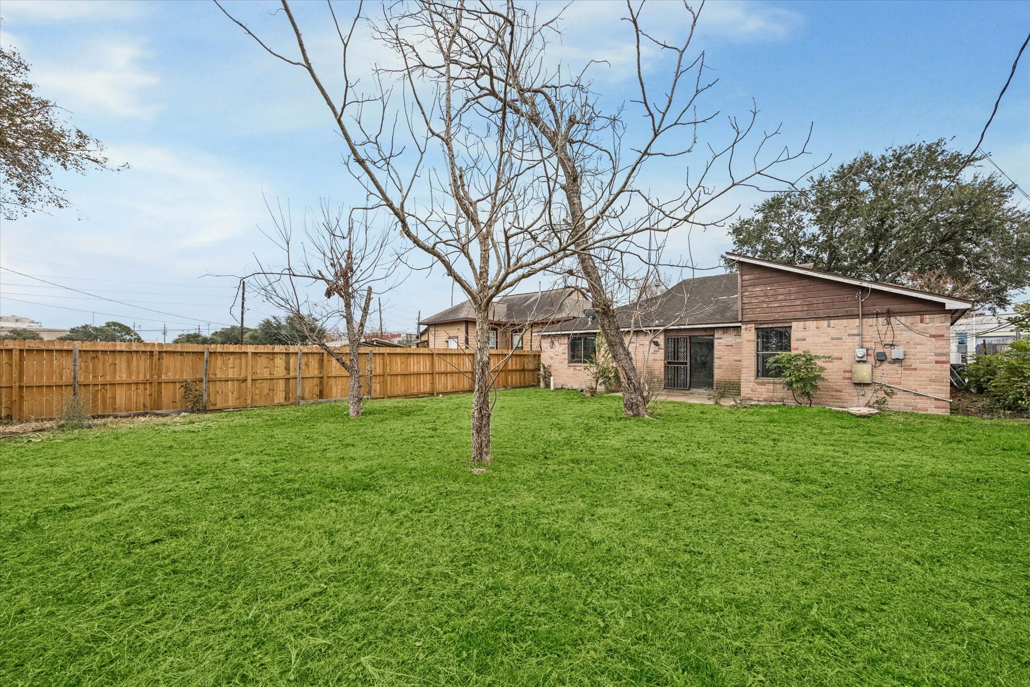 9910 Genard Road Houston, TX 77041 - Photo 15 of 15 a view of a house with backyard and garden