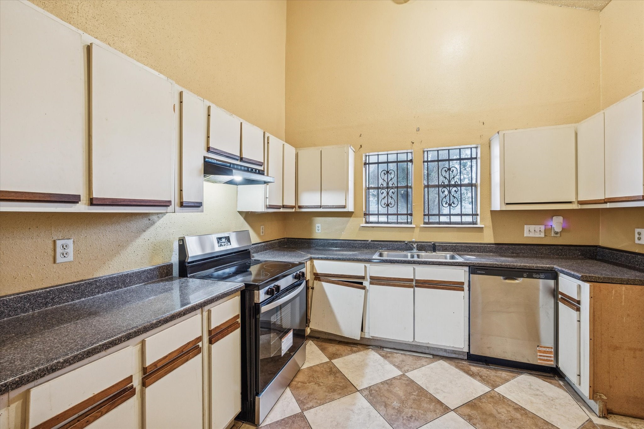 9910 Genard Road Houston, TX 77041 - Photo 5 of 15 a kitchen with stainless steel appliances granite countertop a sink stove and cabinets