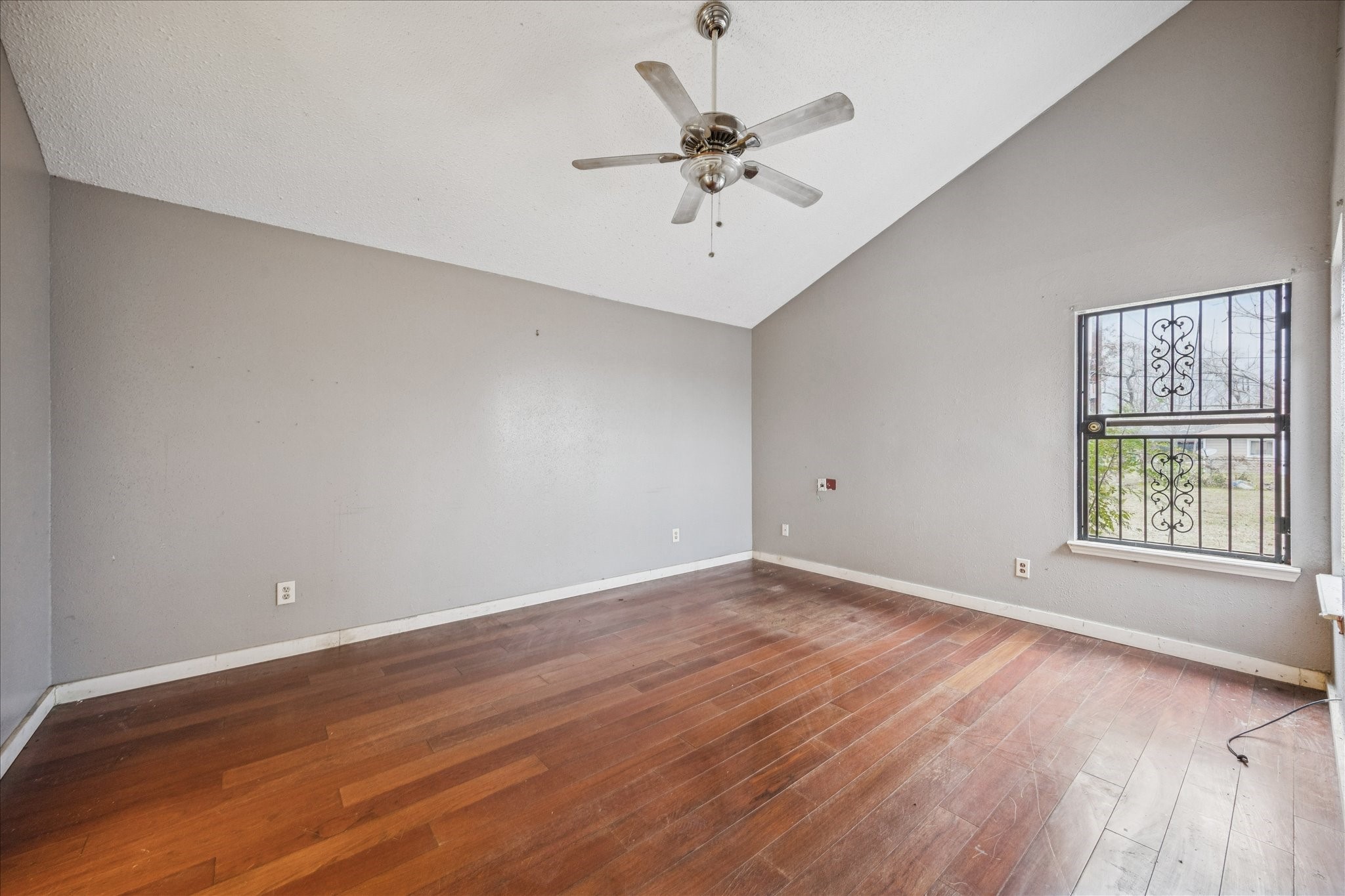 9910 Genard Road Houston, TX 77041 - Photo 7 of 15 wooden floor in an empty room with a window