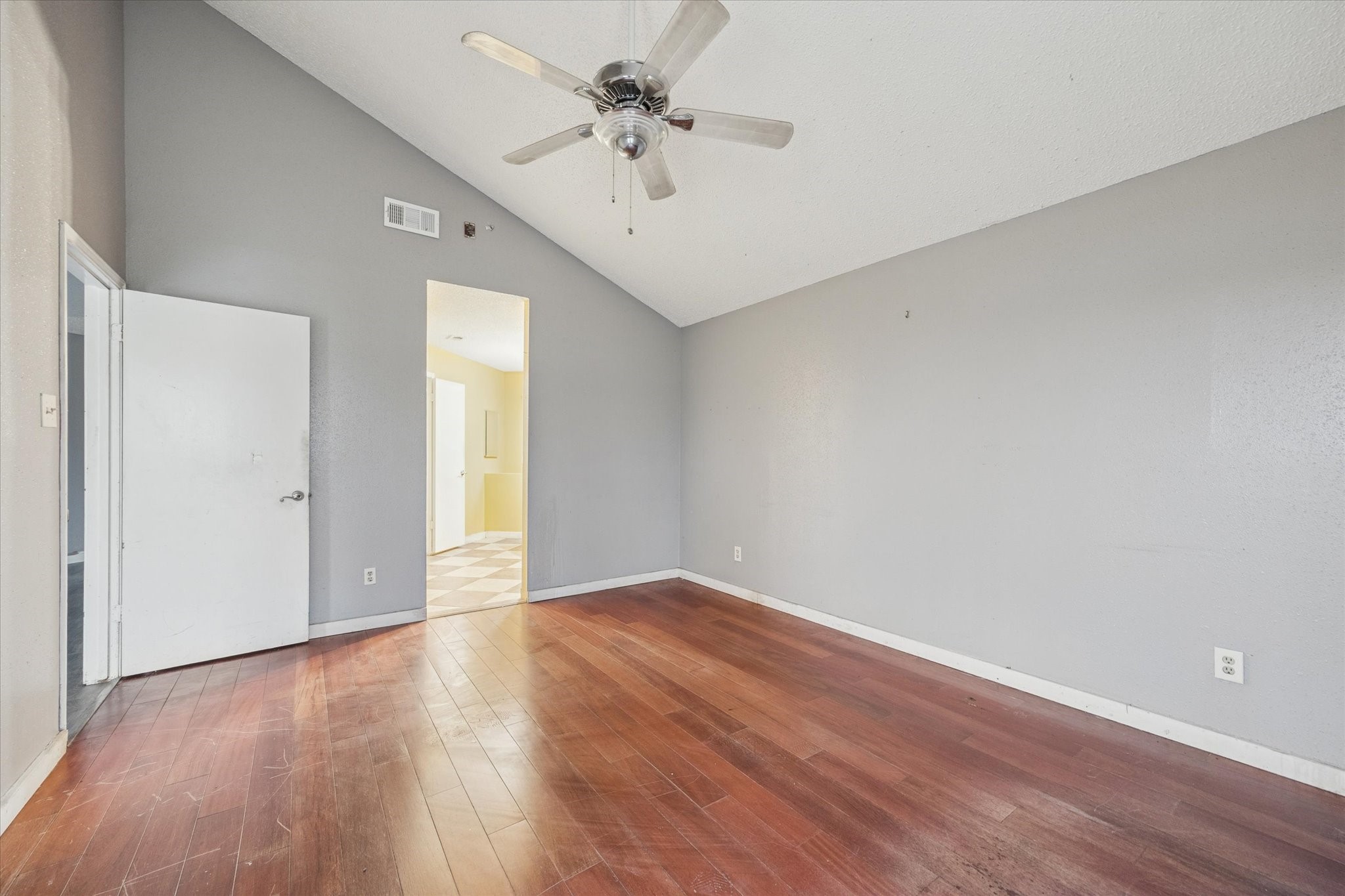 9910 Genard Road Houston, TX 77041 - Photo 8 of 15 a view of an empty room with window and wooden floor