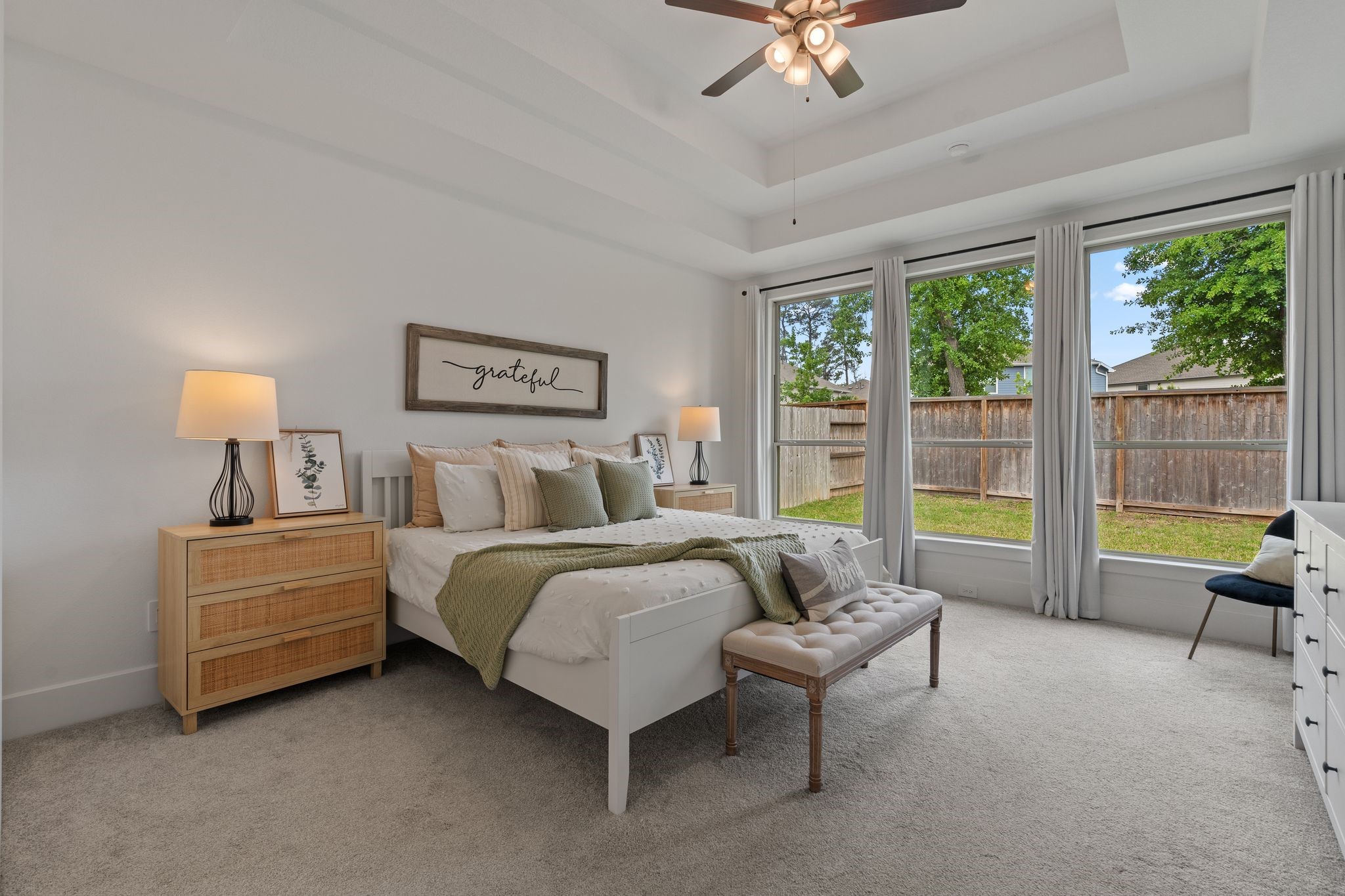 914 Sendero Trail Conroe, TX 77304 - Photo 17 of 47 Restful primary suite features new carpet and double tray ceiling details.