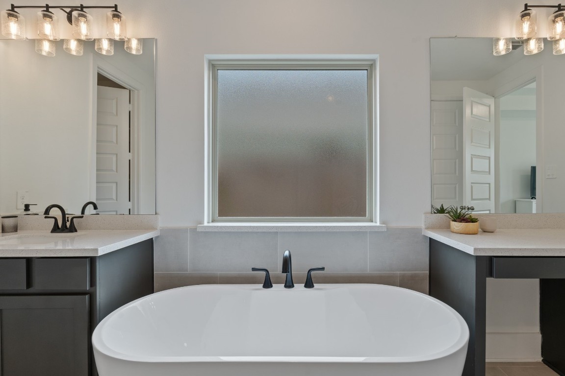 914 Sendero Trail Conroe, TX 77304 - Photo 20 of 50 a bathroom with a sink a toilet and mirror