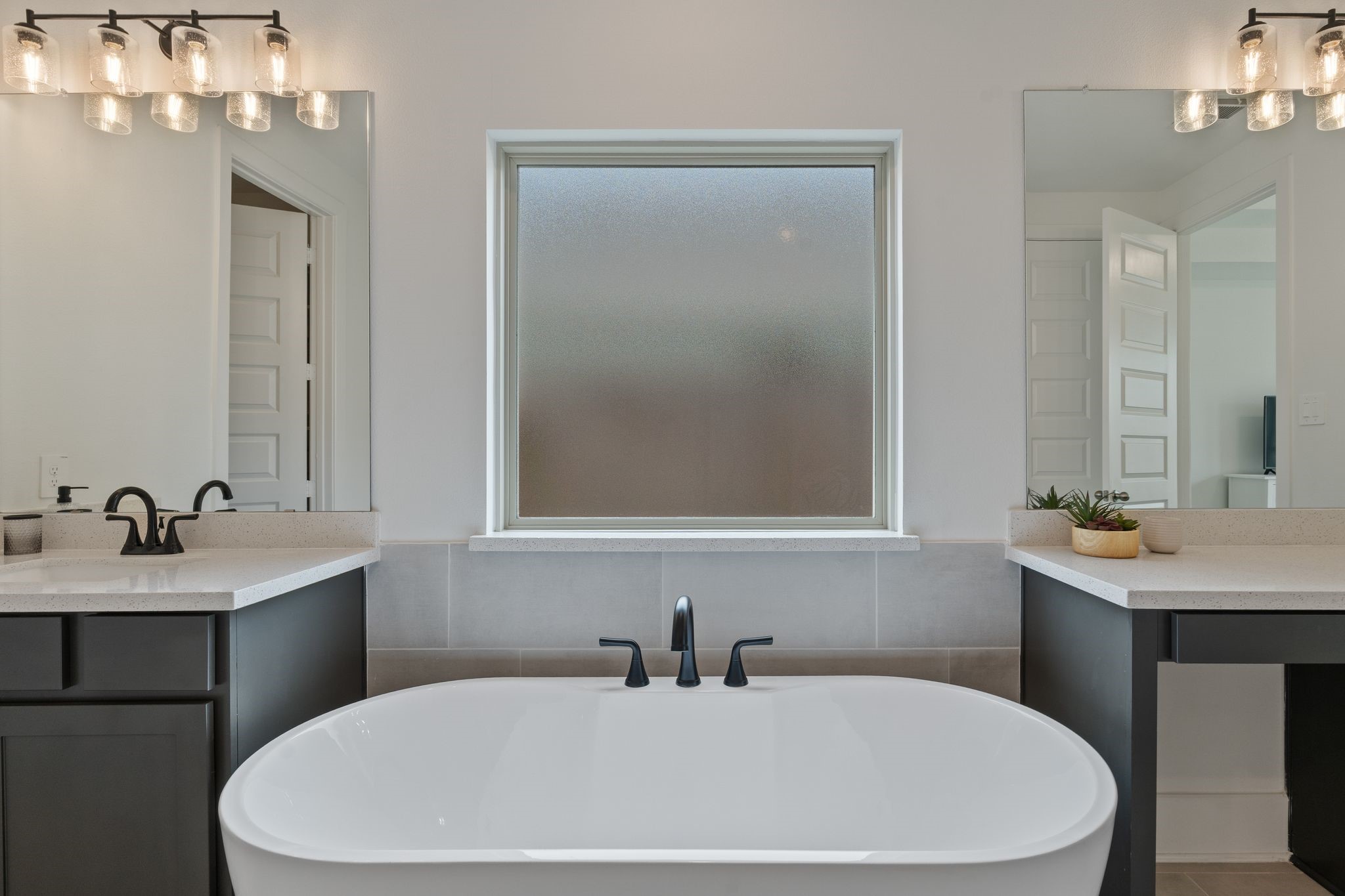 914 Sendero Trail Conroe, TX 77304 - Photo 20 of 47 Imaging unwinding from a long day in this spacious spa-like bathroom.