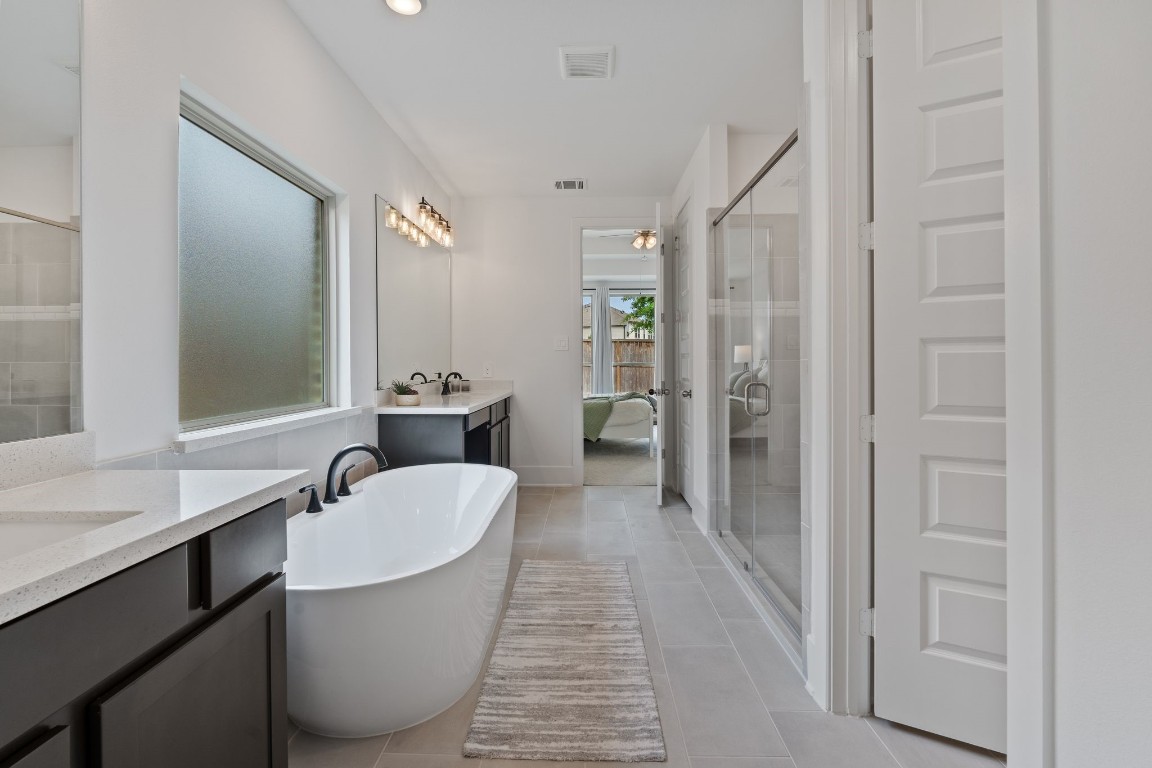 914 Sendero Trail Conroe, TX 77304 - Photo 22 of 50 a bathroom with a sink a toilet and shower