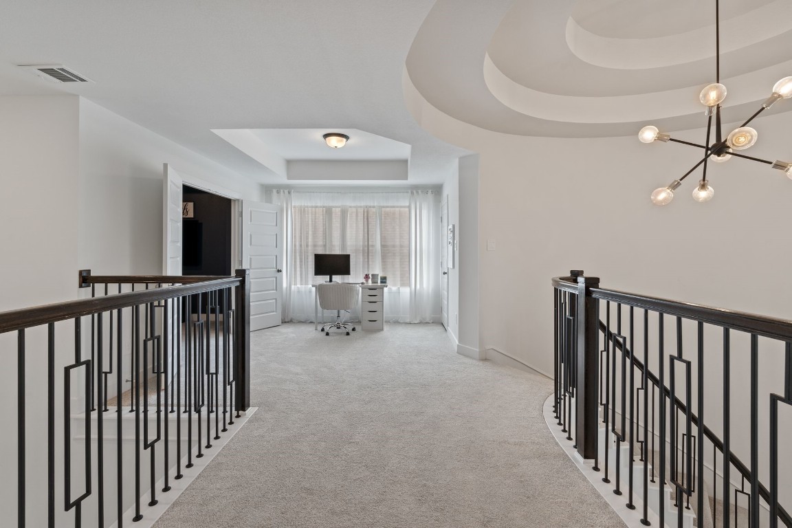 914 Sendero Trail Conroe, TX 77304 - Photo 29 of 50 a view of a hallway with a white stove and a refrigerator