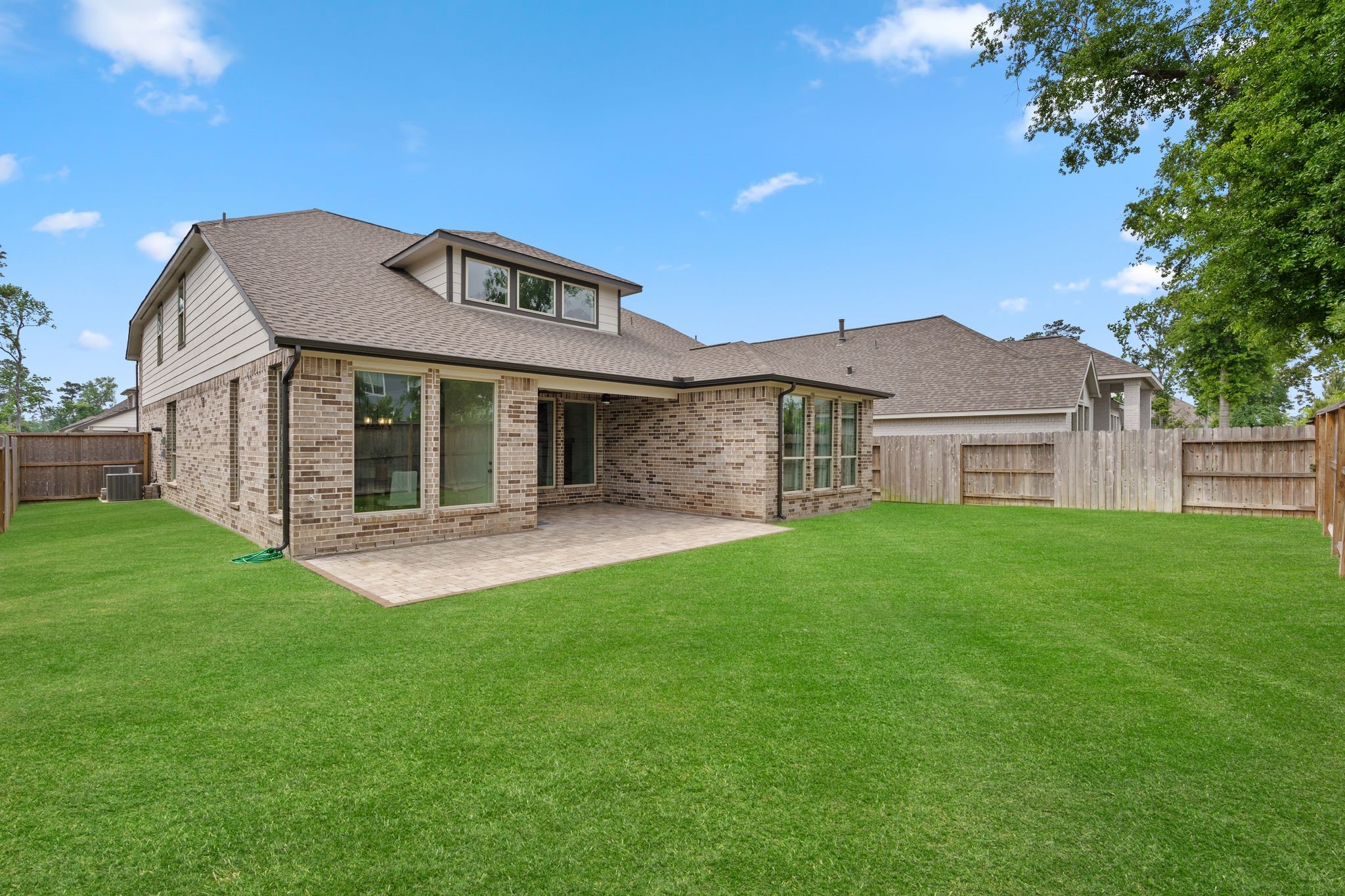 914 Sendero Trail Conroe, TX 77304 - Photo 41 of 47 Spacious backyard area, notice full house gutters.