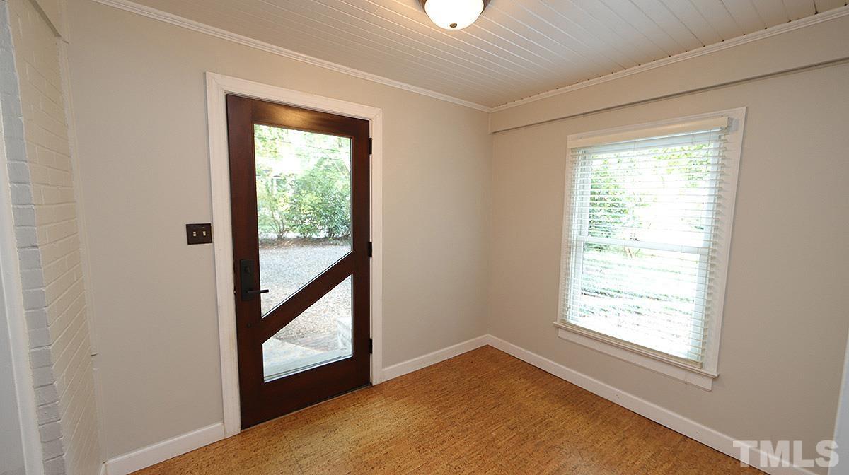 829 Runnymede Road Raleigh, NC 27607 - Photo 3 of 29 a view of an empty room and window