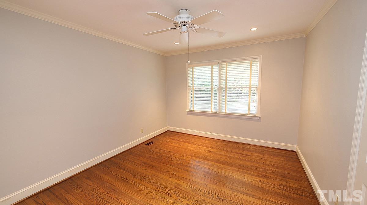 829 Runnymede Road Raleigh, NC 27607 - Photo 23 of 29 an empty room with a window and a fan