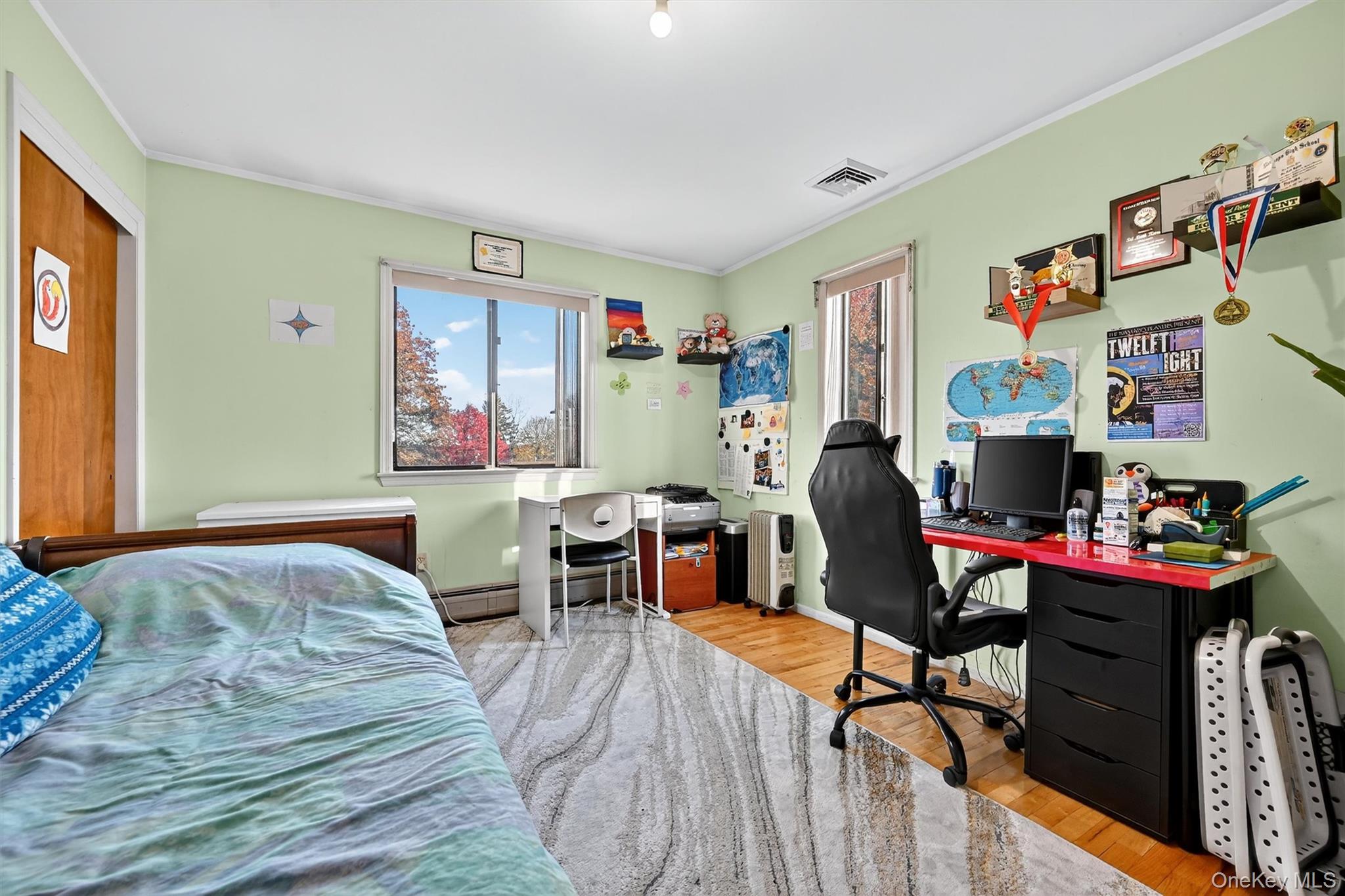 5 Schettig Court Spring Valley, NY 10977 - Photo 15 of 26 a bedroom with a bed and a desk