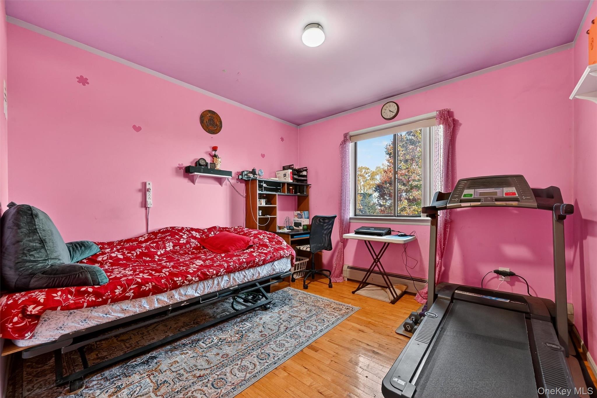 5 Schettig Court Spring Valley, NY 10977 - Photo 17 of 26 a bedroom with a bed and wooden floor