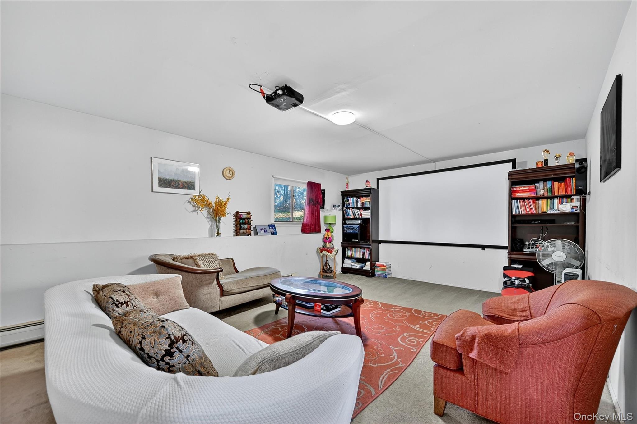 5 Schettig Court Spring Valley, NY 10977 - Photo 19 of 26 a living room with furniture and a flat screen tv