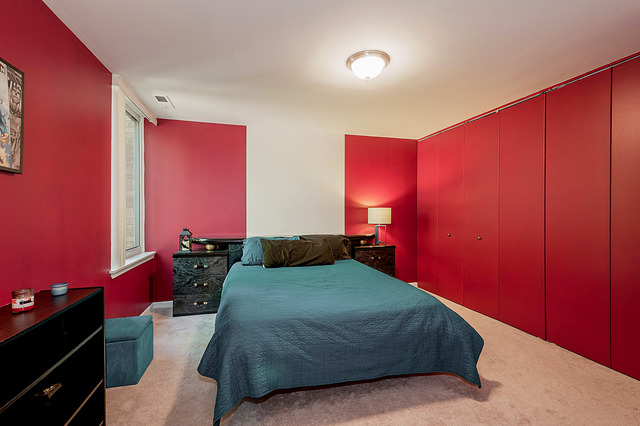 6017 Forest View Road, Unit 2C Lisle, IL 60532 - Photo 9 of 10 a bedroom with a bed and a dresser