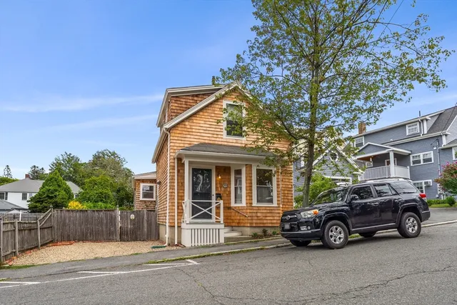 a car parked in front of a house