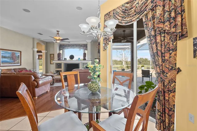 a spacious bathroom with a tub a double vanity sink a large mirror and a bathtub next to a window