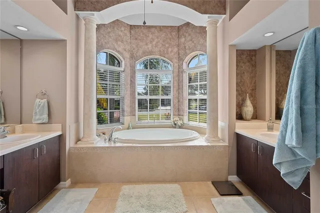 a view of a livingroom with furniture and floor to ceiling window