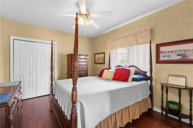 an aerial view of a residential houses with yard