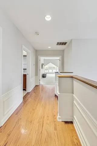 a bedroom with a bed and a view of kitchen