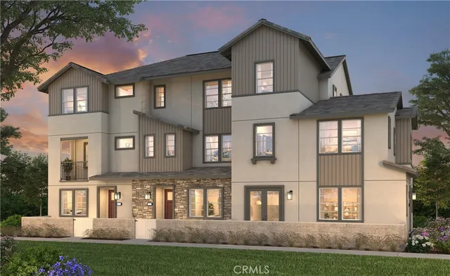 a front view of residential houses with yard and green space