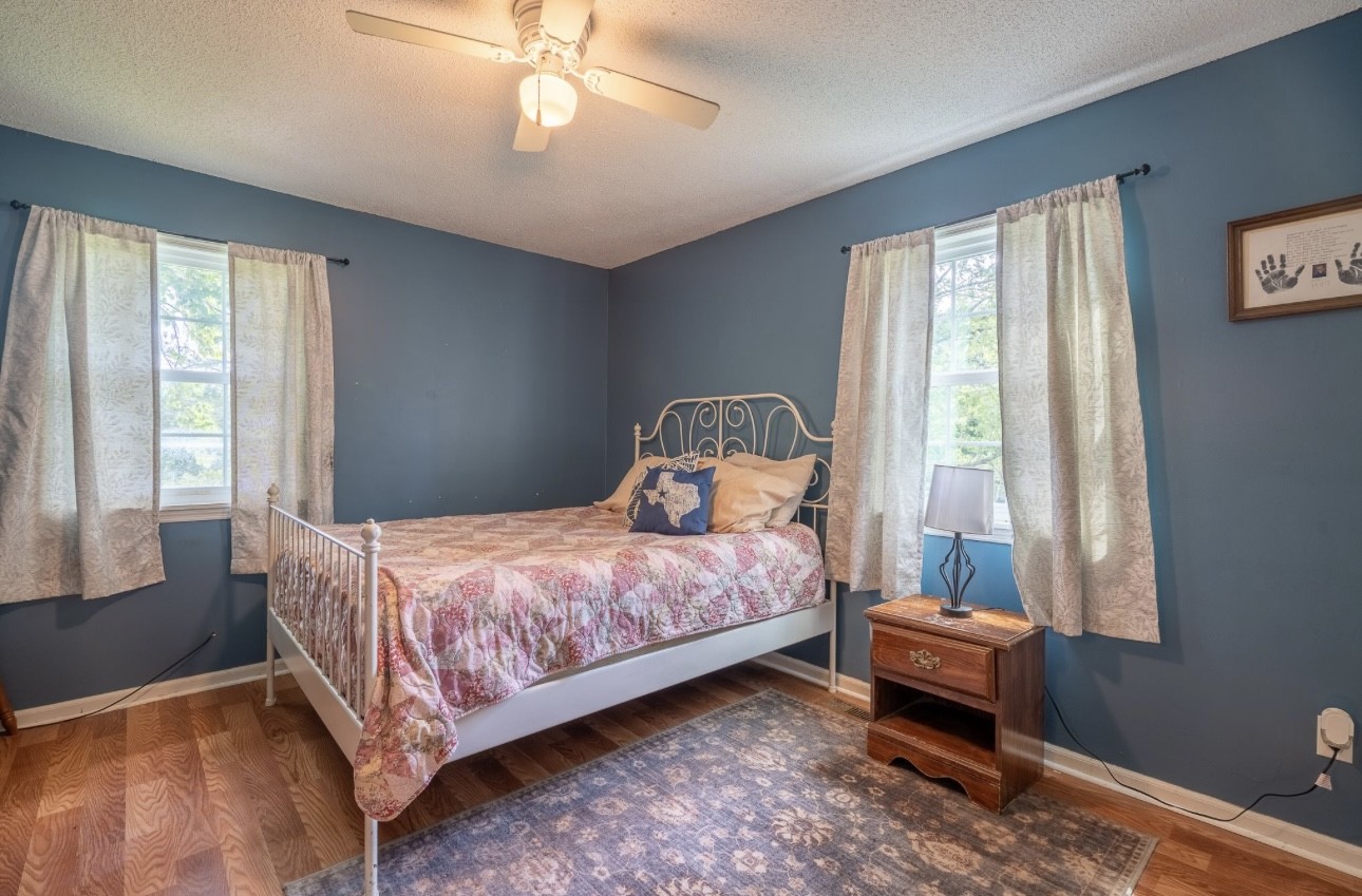 652 Old Florence Pulaski Road Leoma, TN 38468 - Photo 21 of 35 a bedroom with a bed and a window
