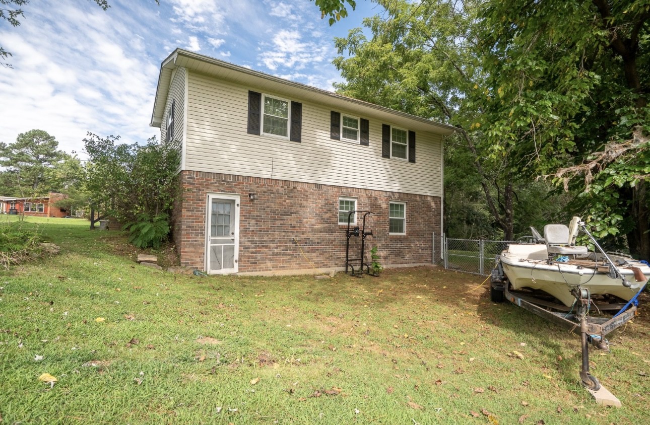 652 Old Florence Pulaski Road Leoma, TN 38468 - Photo 3 of 35 a backyard of a house with table and chairs