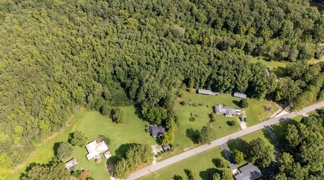 a view of a garden with an outdoor seating