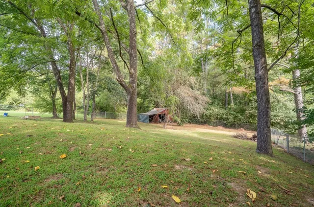 a backyard of a house with a trees