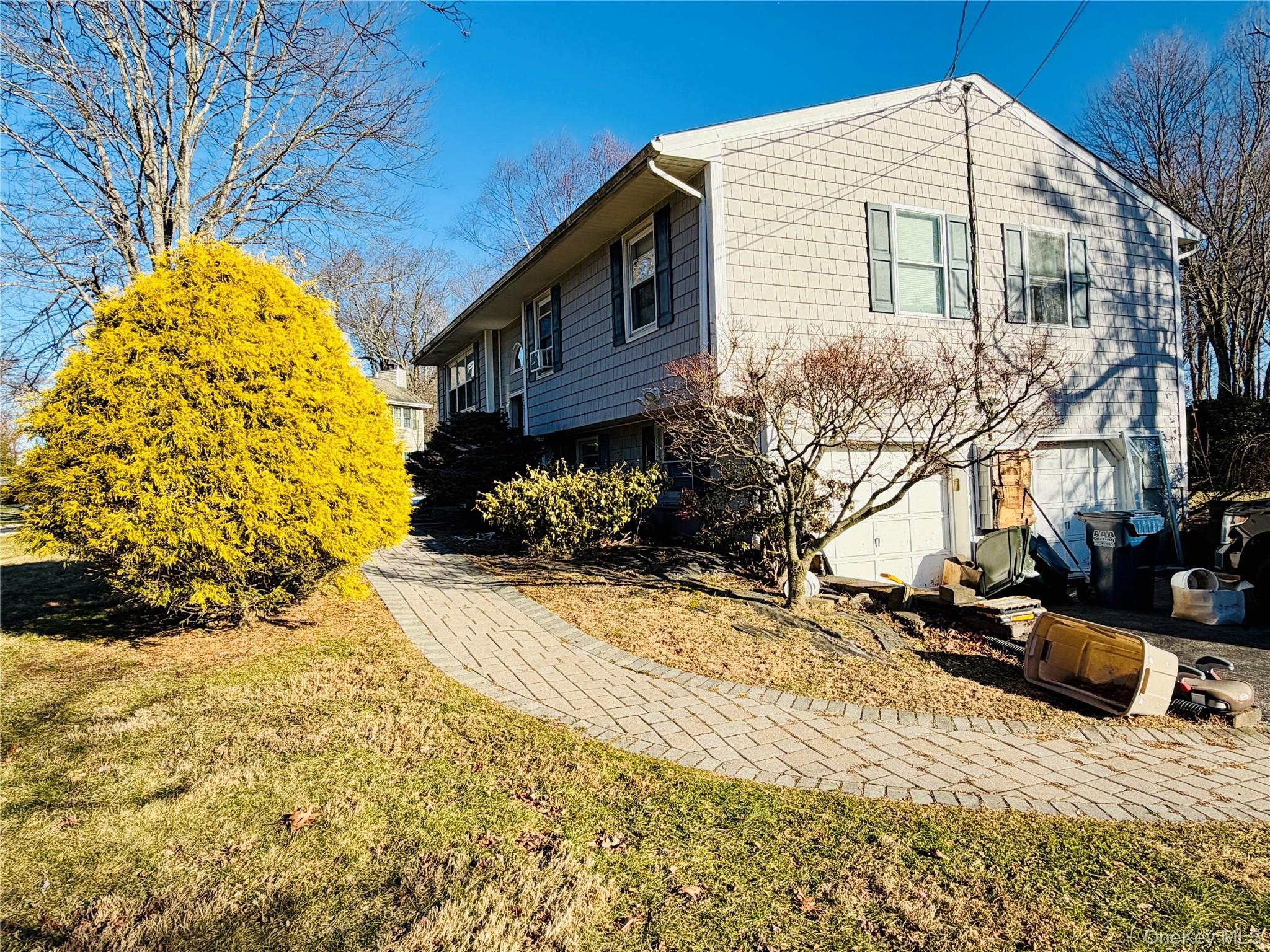 110 Wayacross Road Mahopac, NY 10541 - Photo 6 of 18 View of side of home with a lawn and an attached garage