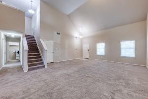 1275 Ophelia Road Forney, TX 75126 - Photo 3 of 10 an empty room with windows and stairs