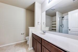 1275 Ophelia Road Forney, TX 75126 - Photo 6 of 10 a bathroom with a sink and a mirror
