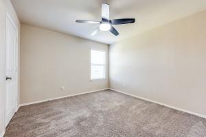 1275 Ophelia Road Forney, TX 75126 - Photo 7 of 10 an empty room with a window and a fan