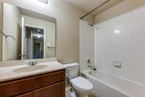 1275 Ophelia Road Forney, TX 75126 - Photo 8 of 10 a bathroom with a sink a toilet and shower