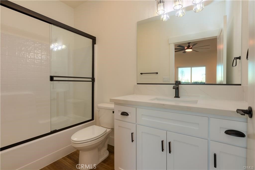 5485 South Libby Road Paradise, CA 95969 - Photo 6 of 6 a bathroom with a sink a toilet and shower a mirror