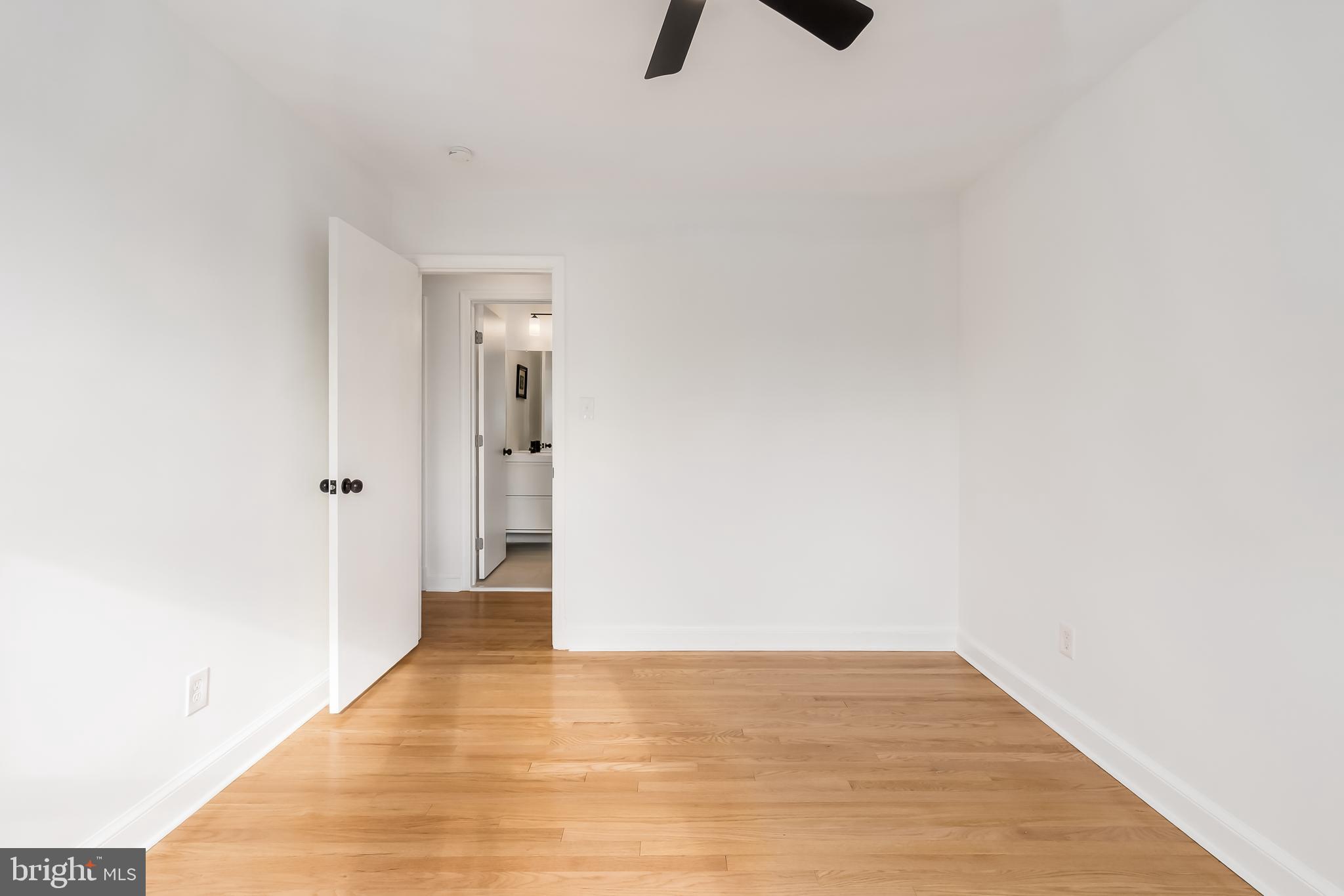 10319 Bethesda Church Road Damascus, MD 20872 - Photo 18 of 41 a view of an empty room with wooden floor