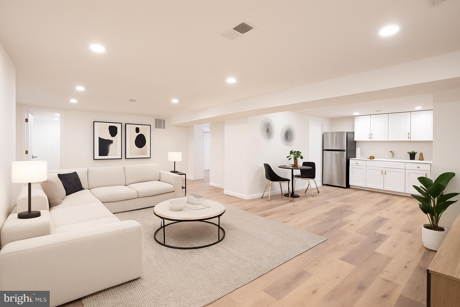 10319 Bethesda Church Road Damascus, MD 20872 - Photo 20 of 41 a living room with furniture and white kitchen