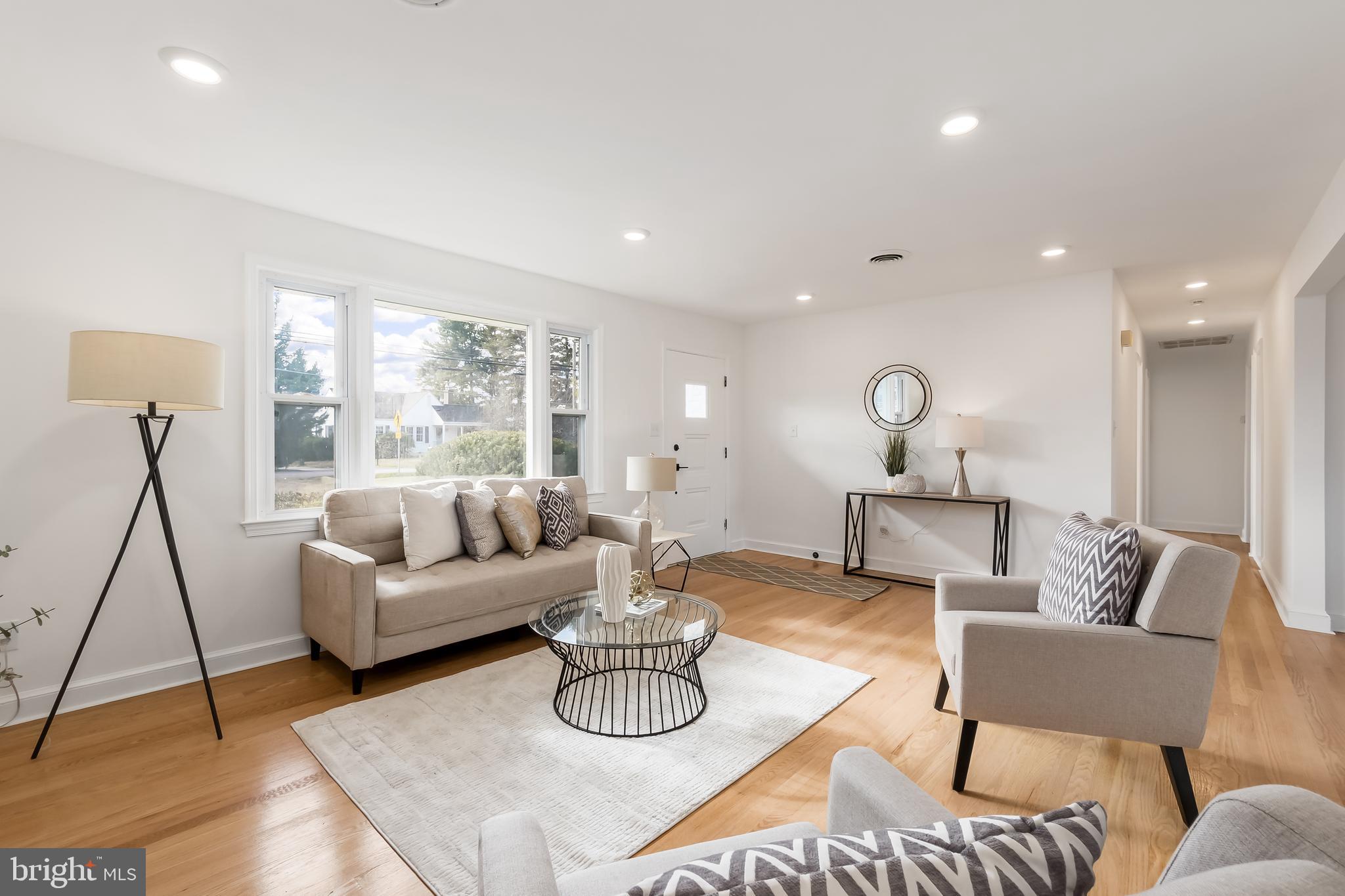 10319 Bethesda Church Road Damascus, MD 20872 - Photo 2 of 41 a living room with furniture and a table