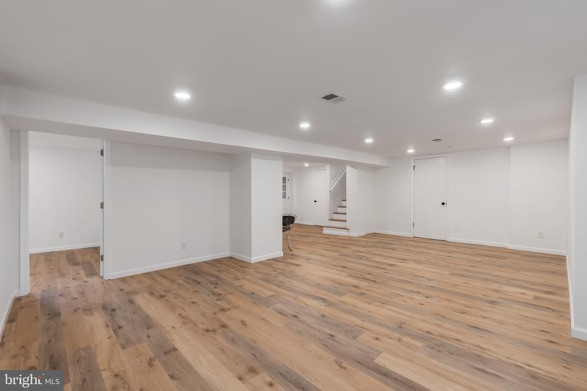 10319 Bethesda Church Road Damascus, MD 20872 - Photo 23 of 41 a view of empty room with wooden floor