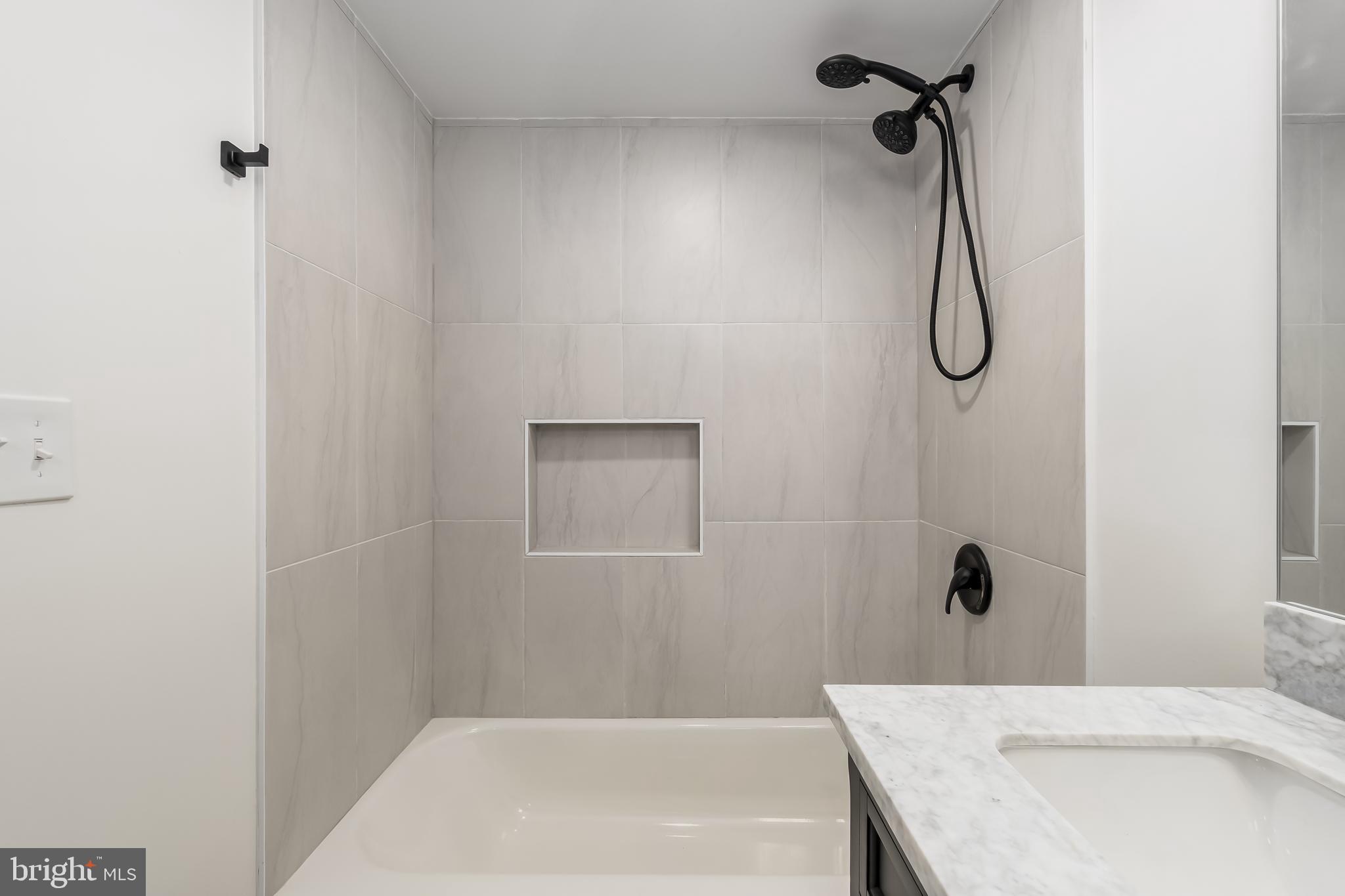 10319 Bethesda Church Road Damascus, MD 20872 - Photo 26 of 41 a bathroom with a shower and a bathtub